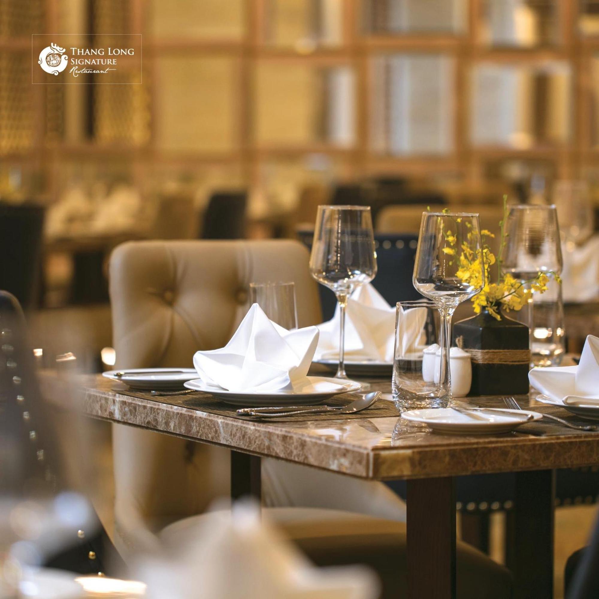 The Oriental Jade Hotel Hanoi Exterior photo A table set for fine dining