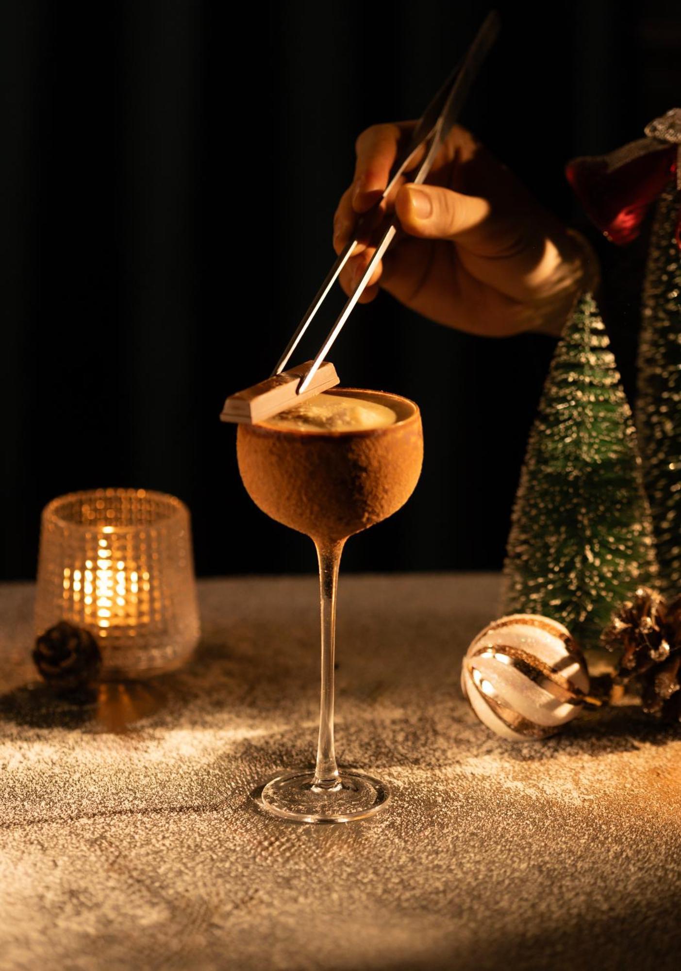 The Oriental Jade Hotel Hanoi Exterior photo A Glayva being garnished with a star anise